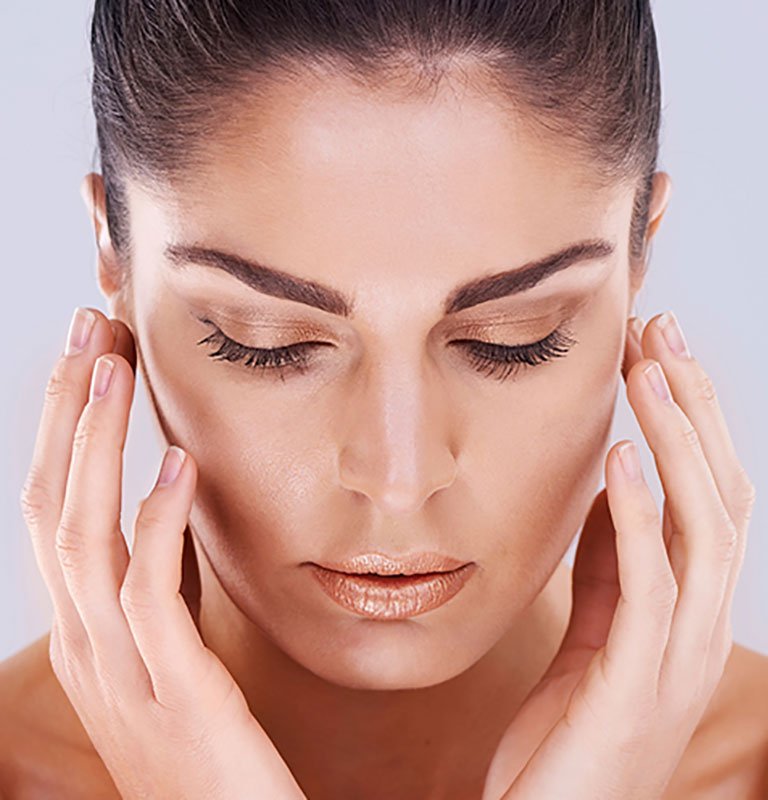 woman-touching-face_lg